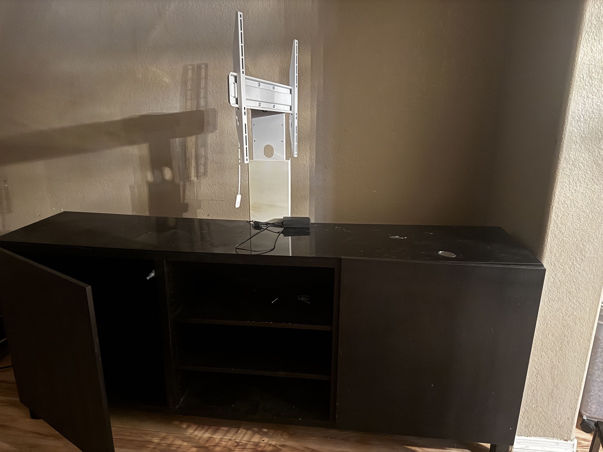 Entertainment Center With TV Holder Attachment Thing