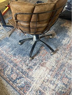 Spinning baseball glove shaped office chair