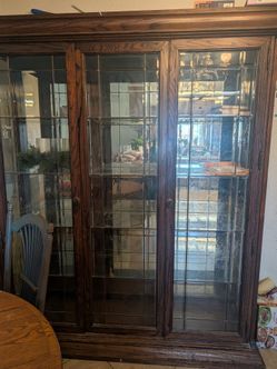 Large wood and glass china hutch $150