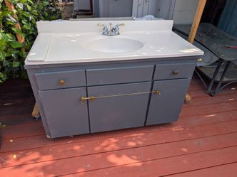 Bathroom vanity with complete faucet plumbing in very good condition it's only $50 for the whole thing. You let me know