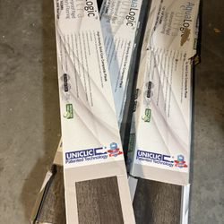 2 sealed Boxes  and one is 1/2  full New AquaLogic Ultra Waterproof Rigid Luxury Flooring. Each box overs 24.14 Sq Ft.  Rustic Timber Color