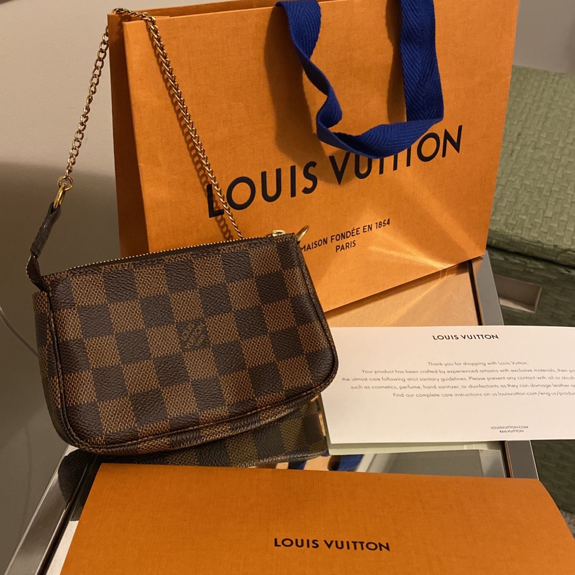 Louis Vuitton Pochette Mini Canvas Wristlet