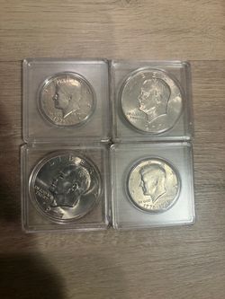 Vintage 1977 Eisenhower Dollars and 1(contact info removed) Bicentennial Half Dollars (Cases Included)