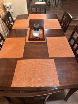 Brown dining table & 6 chairs