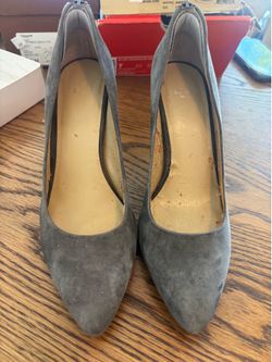 Grey suede pumps are size 7.5M.