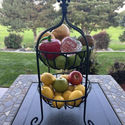 🍎Heavy Metal fruit basket with fake fruit.  2 of the 3 apples are glass. Measures 22” tall and 10” diameter 