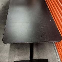 Professional commercial black table with metal legs