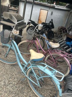2 cruiser bikes pink and blue