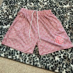 Red Gucci EE shorts with red Gucci logo, size medium