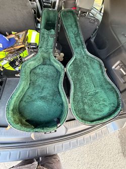 Acoustic guitar case and fender amp