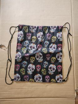 Black nylon bag with pull strings and skull designs