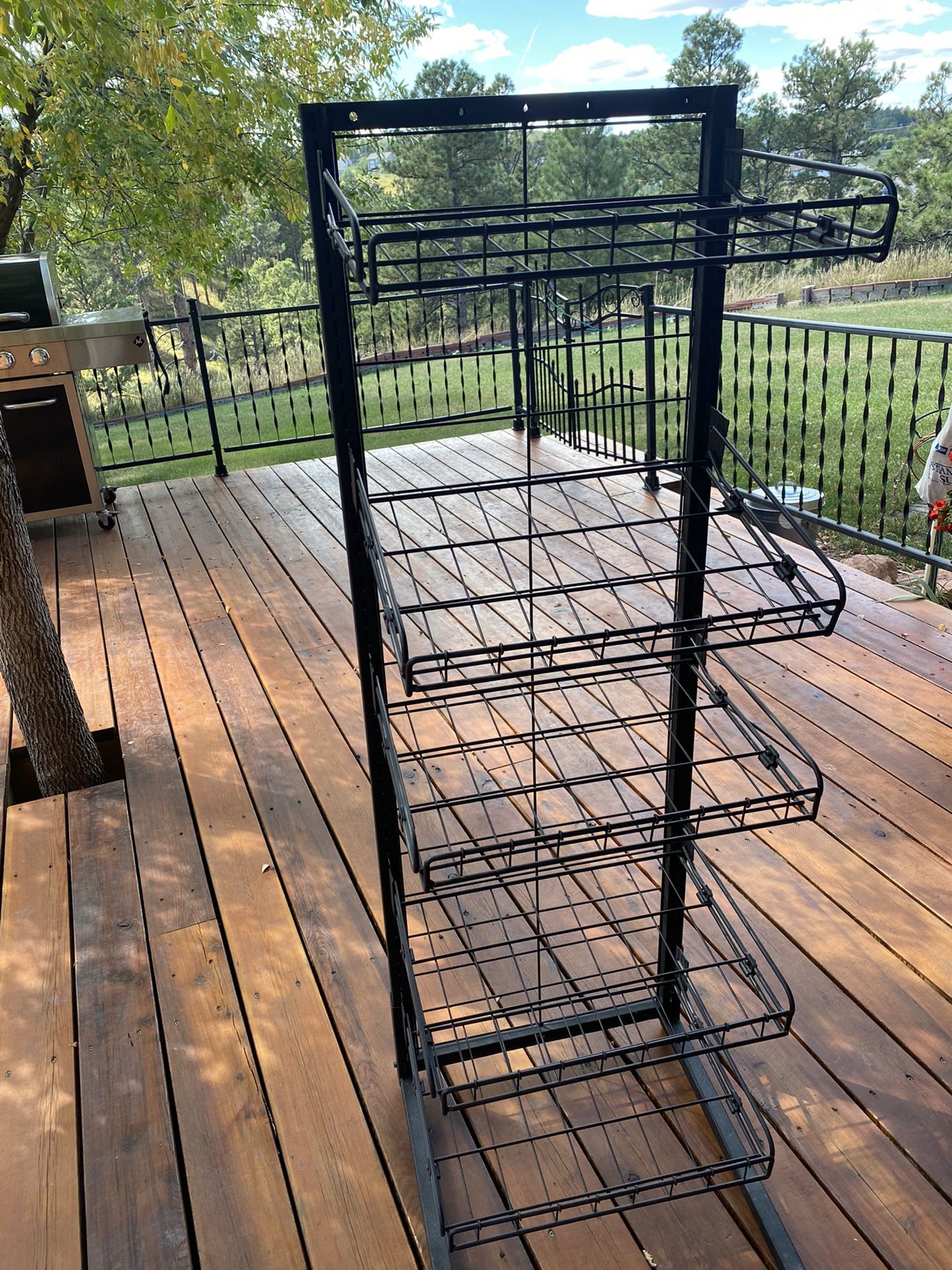 they call it “impulse buy shelving” but versatile for many uses    Steel shelves all adjustable up and down and hang level or straight or forward tilt