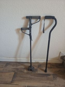 2 walking canes one with built-in flashlight