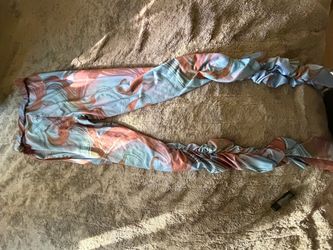 pants in a blue and pink abstract print with ruched detailing