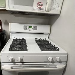 Microwave And Vent Along With Gas Stove. Perfect Condition