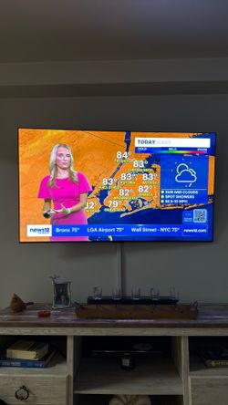Large Flat Screen Wall-Mounted TV