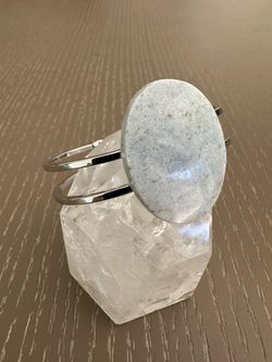 New, beautiful Angelite crystal platinum plated bangle bracelet. Shipping available.