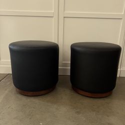 Pair of Room and Board Black Leather Rolling Ottomans with Walnut Bases