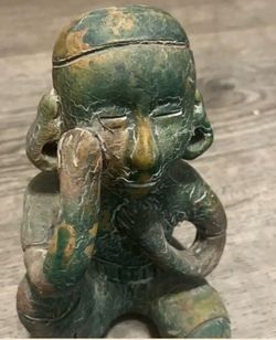 Columbian seated figure