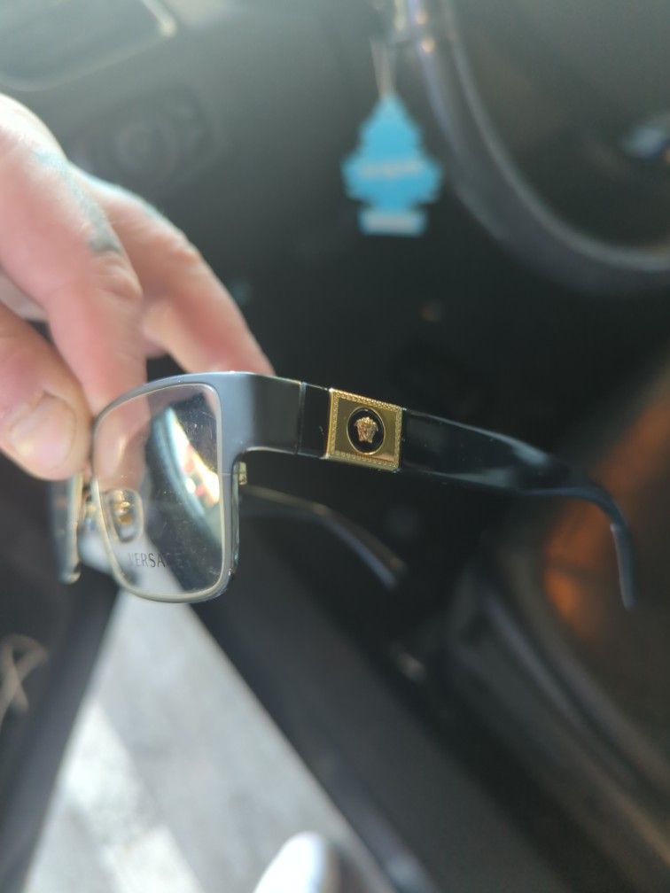 selling Versace glasses Gucci sunglasses and a vintage Gucci watch