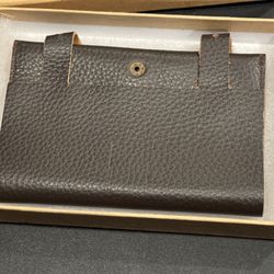 KIKO Leather Cord Wrap. Butter soft cowhide Store and organize multiple cables Fits easily into a briefcase or luggage 5 ½” x 3 ¾” Closed 5 ½” x 10 ½”