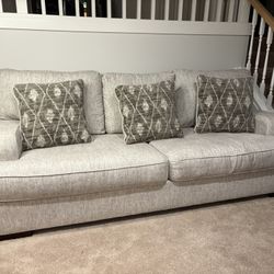 Large Sofa With Three Big Pillows 