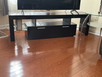Black 63” TV Stand with Large Storage Drawers – Brand New in Box! Duplicate of the one I have in the living room.