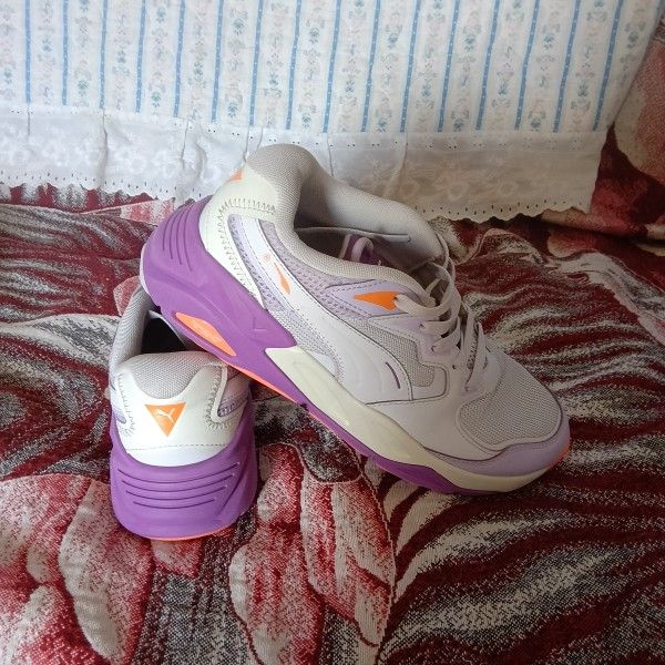 Puma TRC Mira Trail Mix sneakers in a lavender color. 
