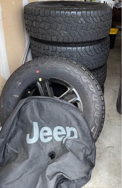 Jeep OEM Rims with like new tires