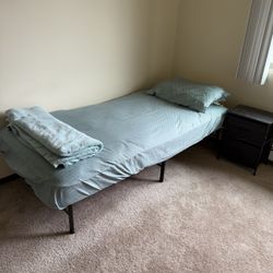 Single bed with mattress and nightstand for sale.