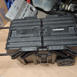 husky rolling tool box with bunch of random tools 