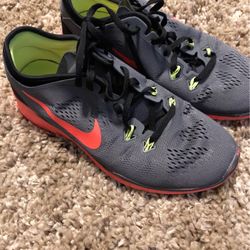 Gray/orange Nikes, Sz 7