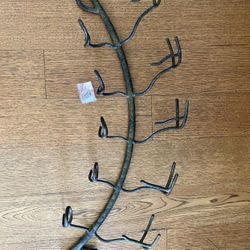 Dark grey metal wall wine rack