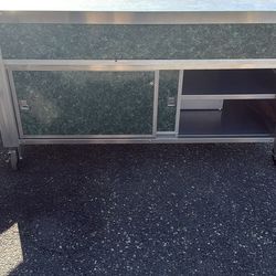 Stainless steel countertop with storage rolling on wheels
