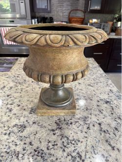 Decorative brown urn planter.
