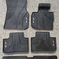 BMW x3 OEM all weather floor mats and trunk liner