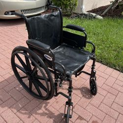 Wheelchair with footrests, $100