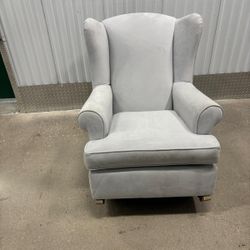 Light gray suede rocking chair.   Very comfortable… 33” wide, 34” depth , 37” high .. $100 Perfect for the nursery or a living room.  Delivery availab
