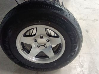 Brand New 215/75/r14 tire on aluminum rim