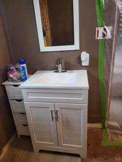 24in white vanity/faucet with mirror and toilet