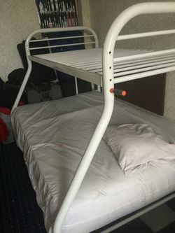 Like new bunk bed with new mattress size twin bed for the top of bed