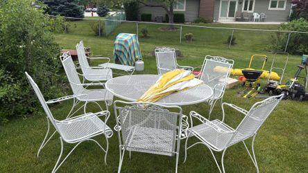 Pristine 1970s Woodard Cast Iron Patio Set bench and side table.