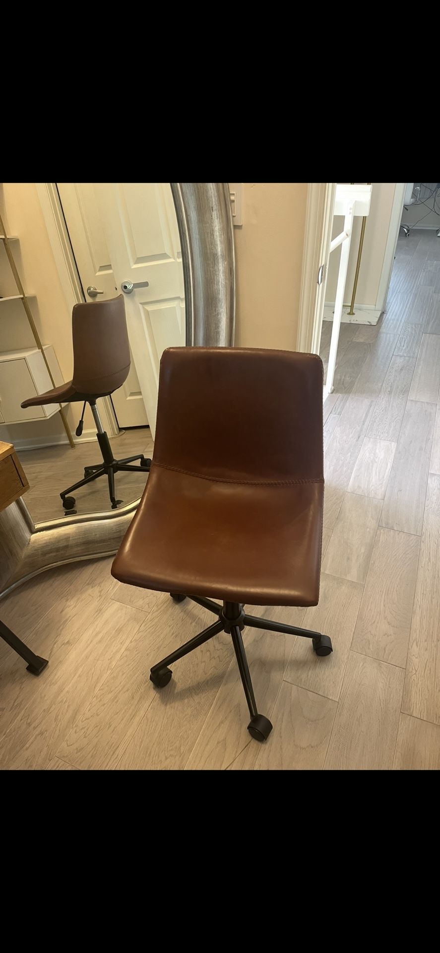 Desk Chair Brown Faux Leather in very good shape. Its height is Adjustable. Very sturdy. Hardly used.