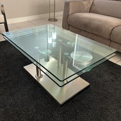 Glass Coffee Table With Two-Tier Design And Metal Base