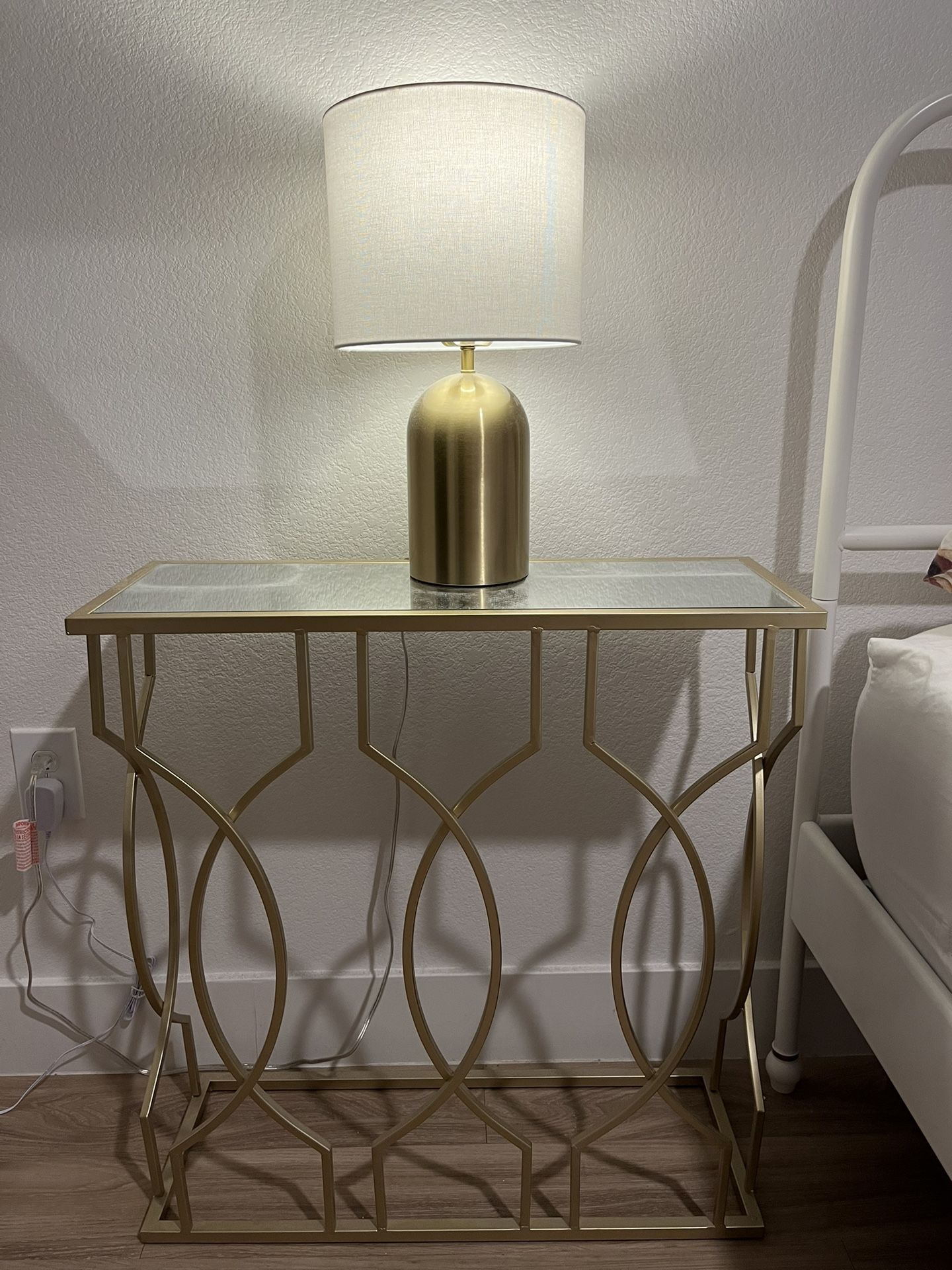 Gold colored table with lamp