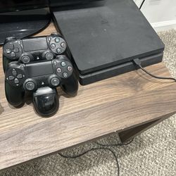PlayStation 4 w/ Controllers, Wireless Charger & Games 