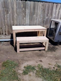 Outdoor table with bench