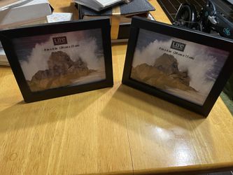 2 standing black frames $10