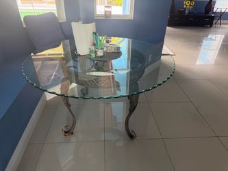Glass dining table seats 4