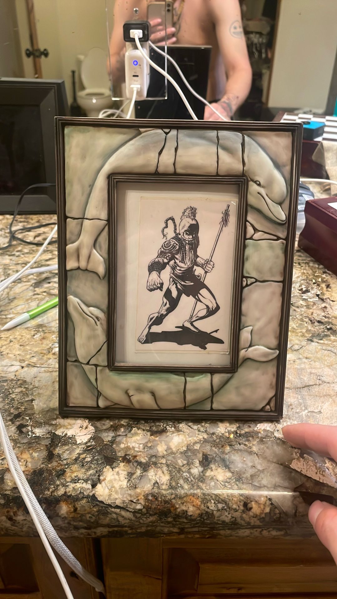 Native American warrior with porcelain dolphin outside
